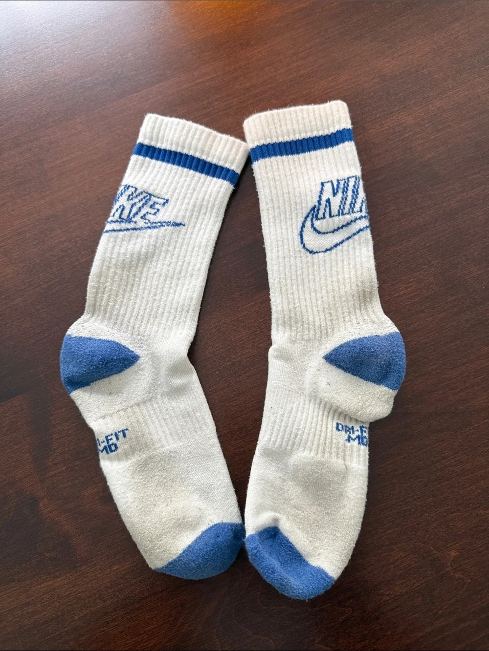 4 pairs Nike White Crew Athletic Socks with Red and Blue Accents heel to toe 8”.